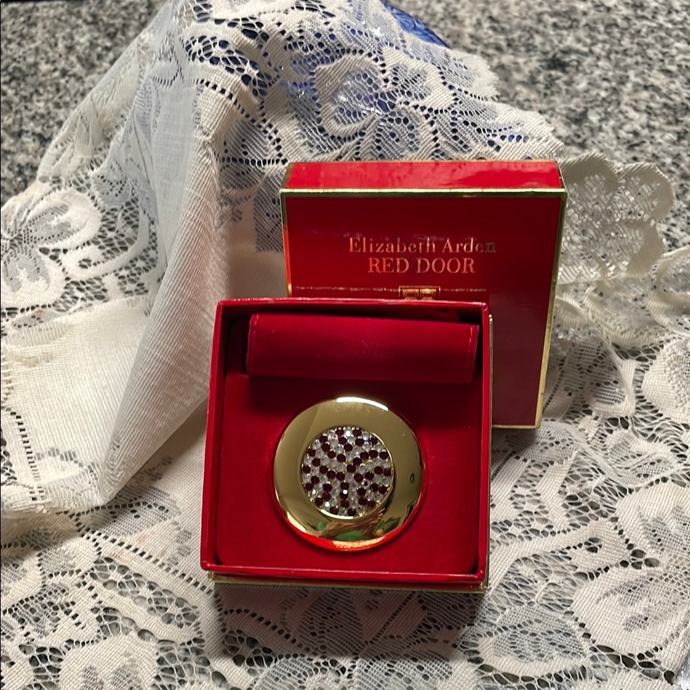 Elizabeth Arden Gold and Red Door collector compact with original box and cover.